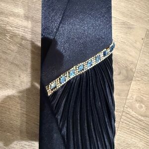 Elegant Black Clutch with Blue Accents it’s dark blue not black